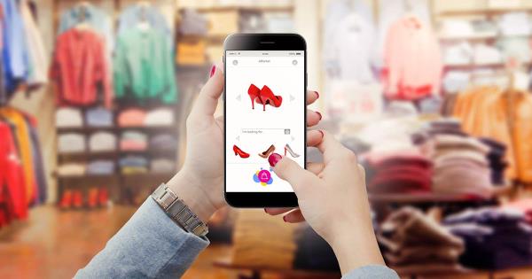 Person looking at shoes in a retail store on a mobile phone